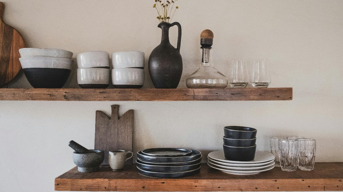 Wooden shelves with kitchen utensils