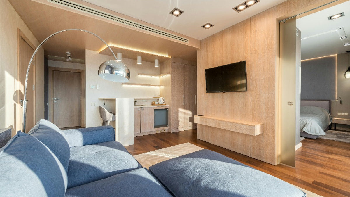 A photo of a modern living room with a gray sofa