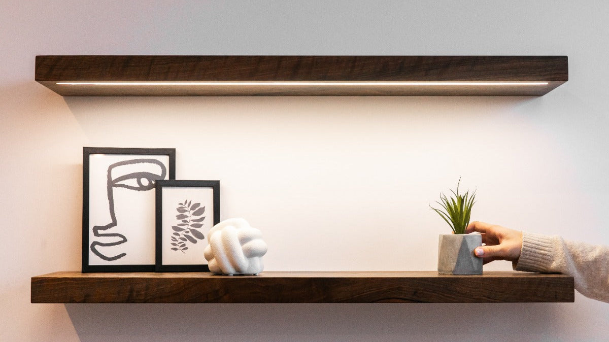 Wood floating shelf with artwork