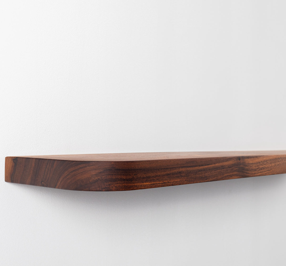 Wooden cutting board on a white background