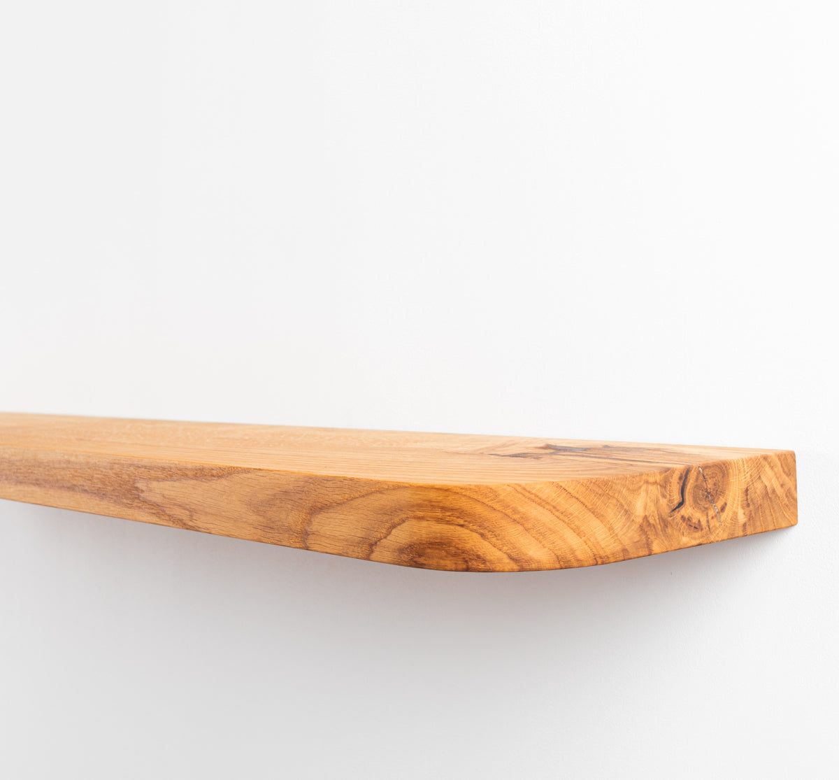 Wooden cutting board on a white background