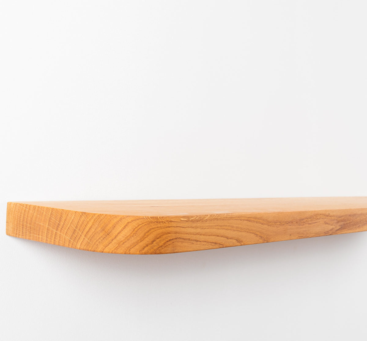 Wooden cutting board on a white background