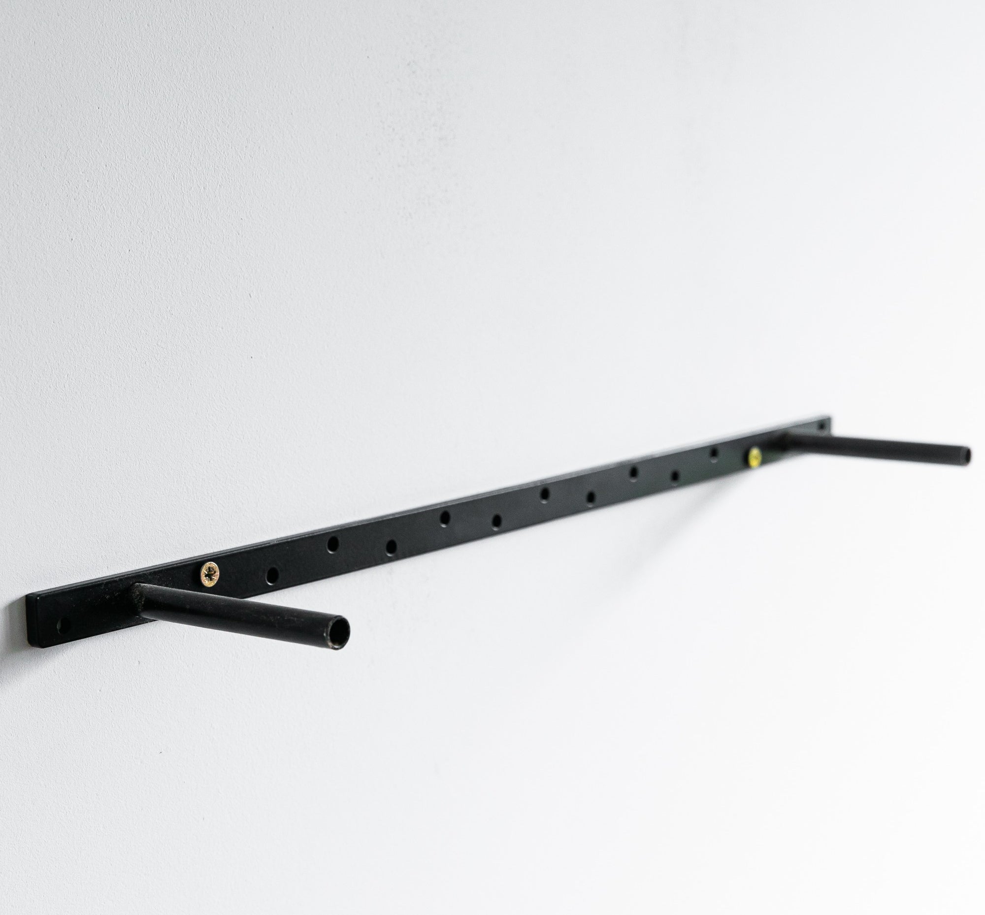 Black metal shelf bracket on a white background