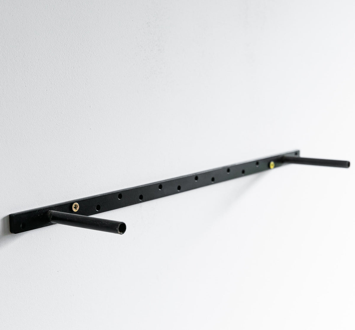 Black metal shelf bracket on a white background