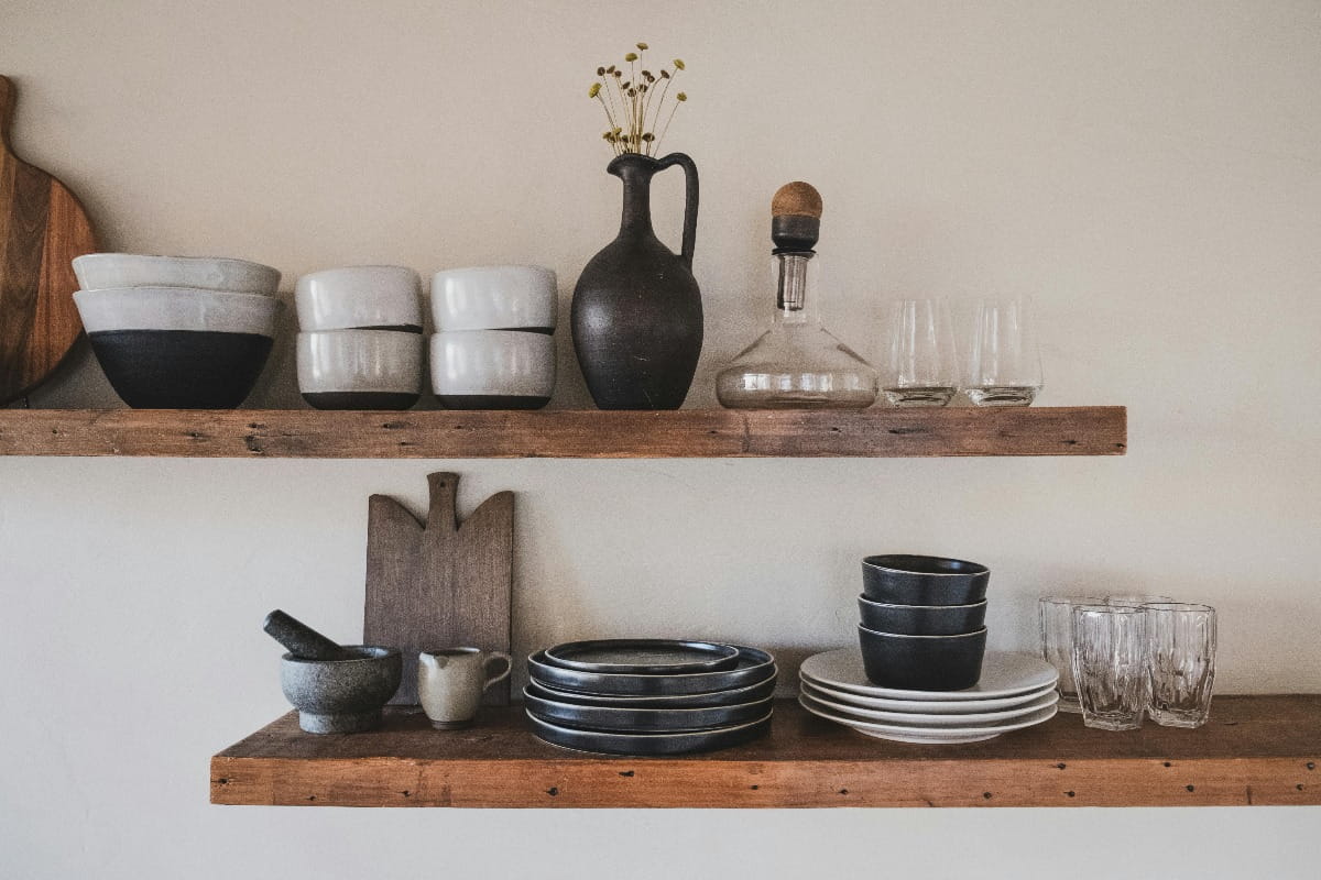 Wooden shelves with kitchen utensils