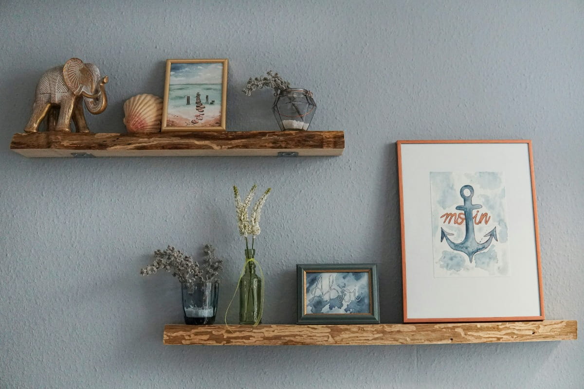  Flowers, glass vase, photos on a wooden wall shelf