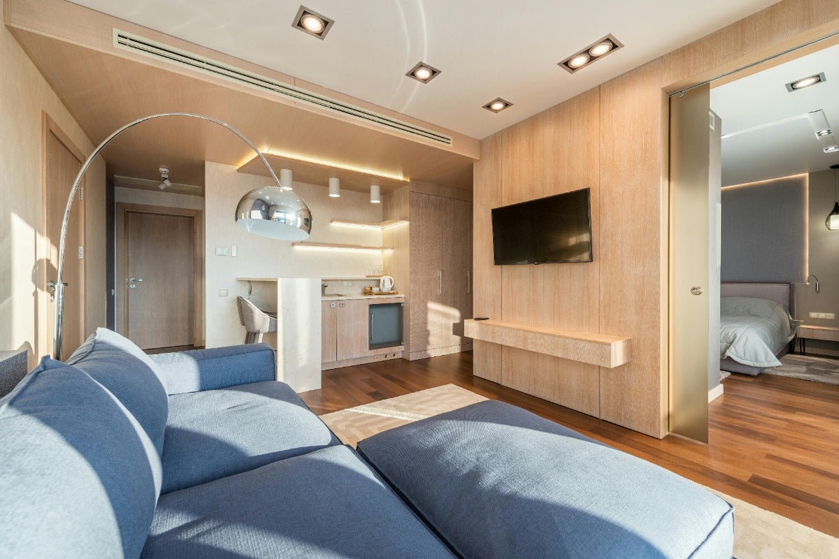 A photo of a modern living room with a gray sofa