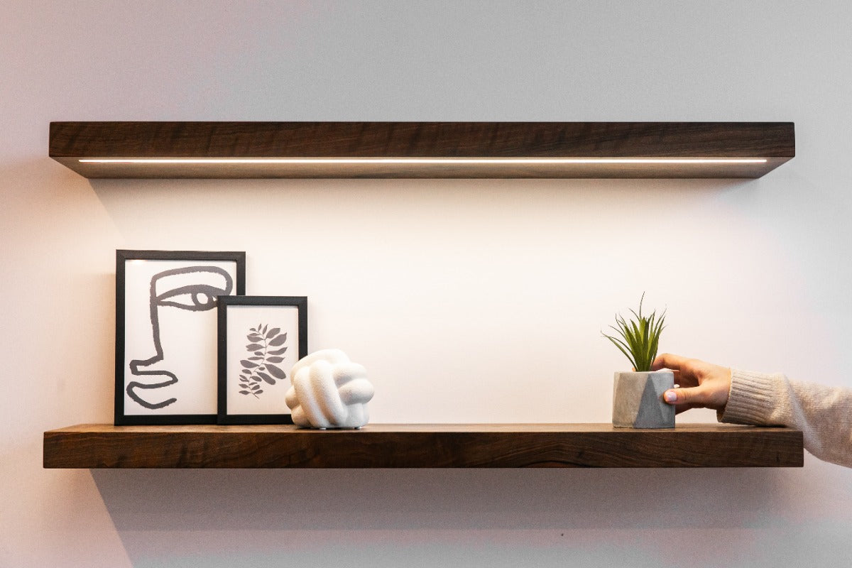 Wood floating shelf with artwork