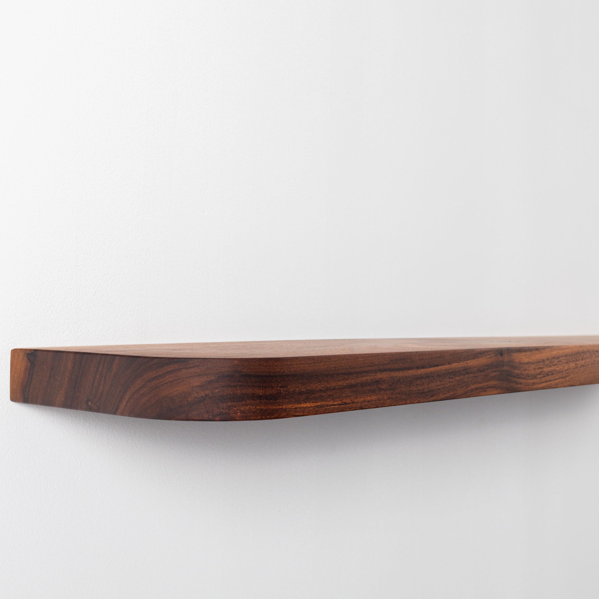 Wooden cutting board on a white background