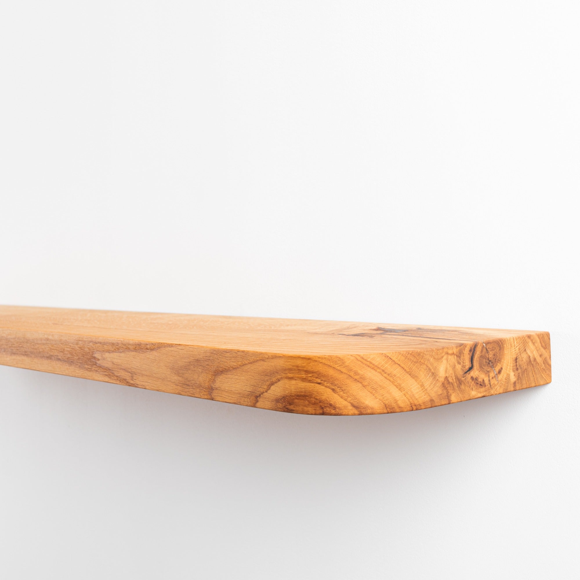 Wooden cutting board on a white background