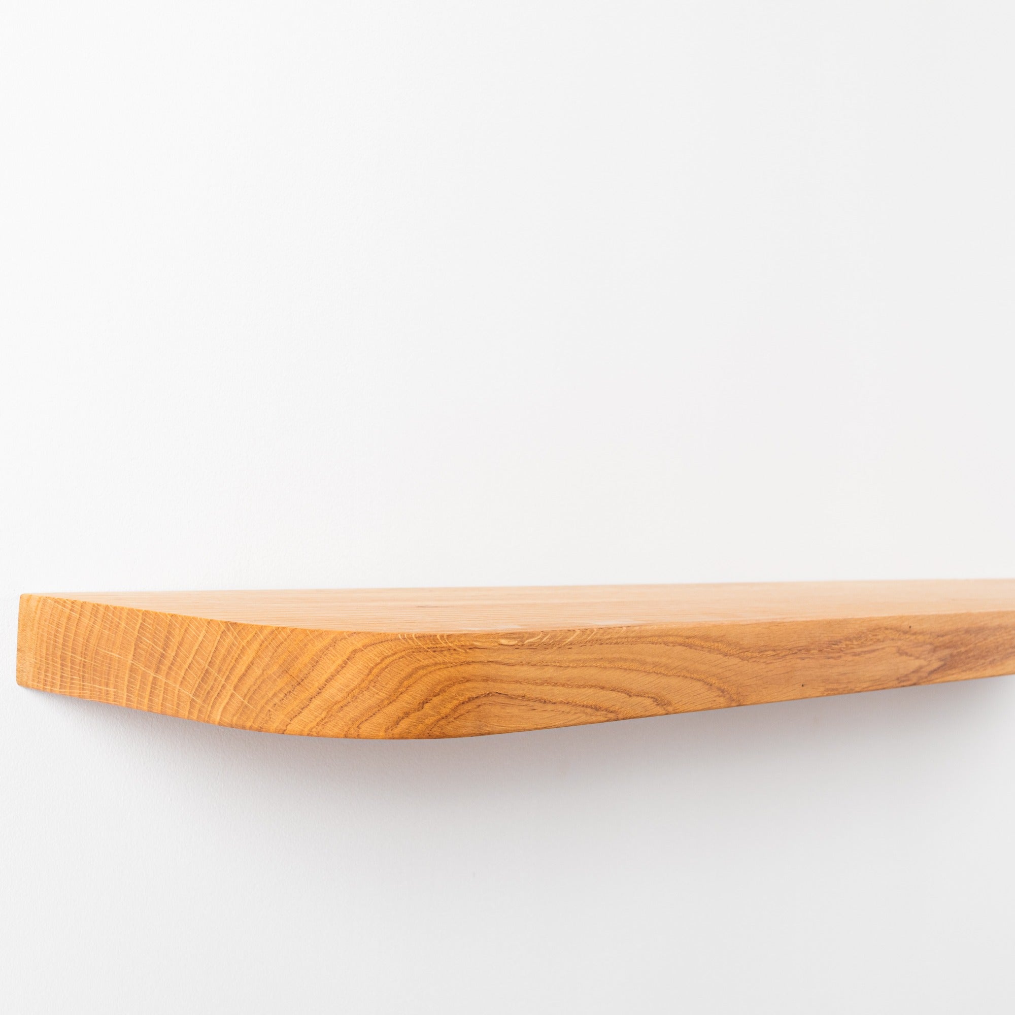 Wooden cutting board on a white background